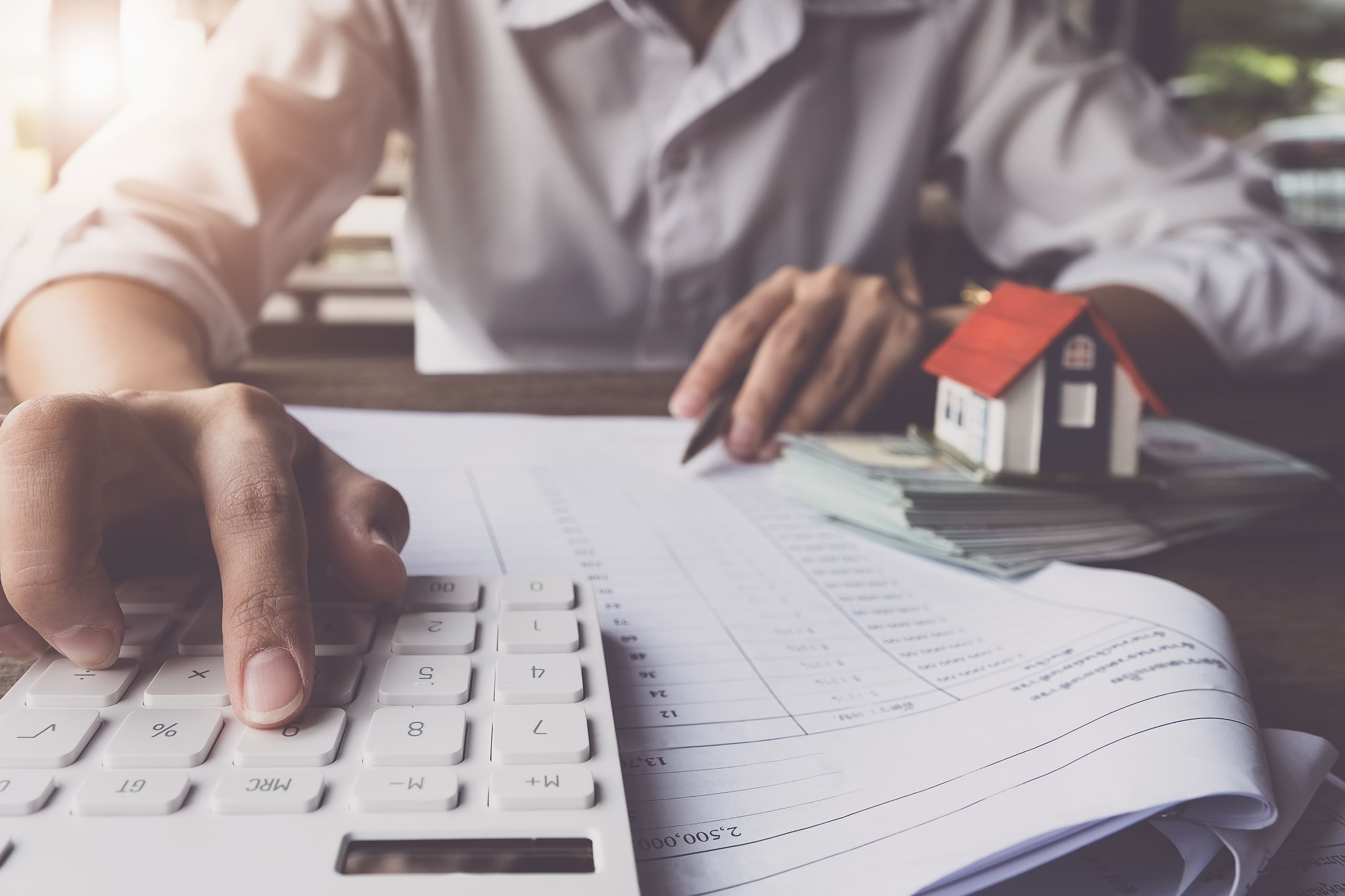 Man using calculator